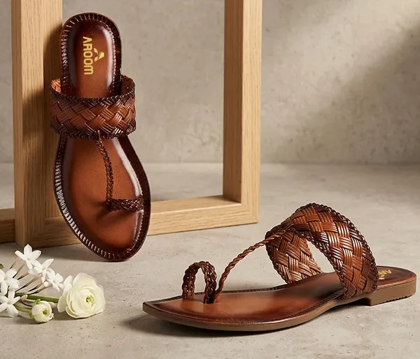 A_pair_of_stylish_women�s_slip-on_loafers_in_a_warm_tan/brown_color_with_a_subtle_ribbed_texture.