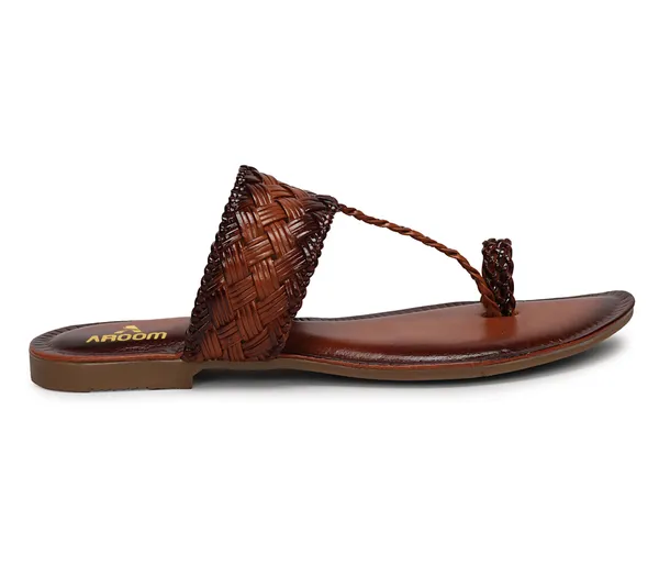 A_pair_of_stylish_women�s_slip-on_loafers_in_a_warm_tan/brown_color_with_a_subtle_ribbed_texture.