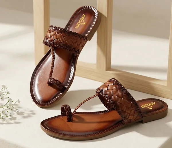 A_pair_of_stylish_women�s_slip-on_loafers_in_a_warm_tan/brown_color_with_a_subtle_ribbed_texture.