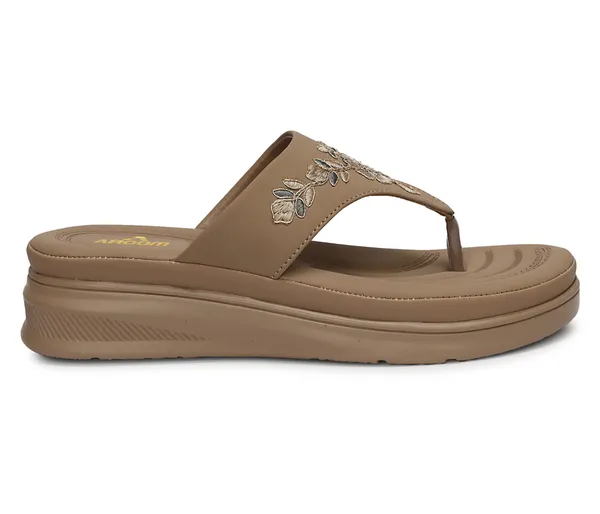 A_pair_of_stylish_women�s_slip-on_loafers_in_a_warm_tan/brown_color_with_a_subtle_ribbed_texture.