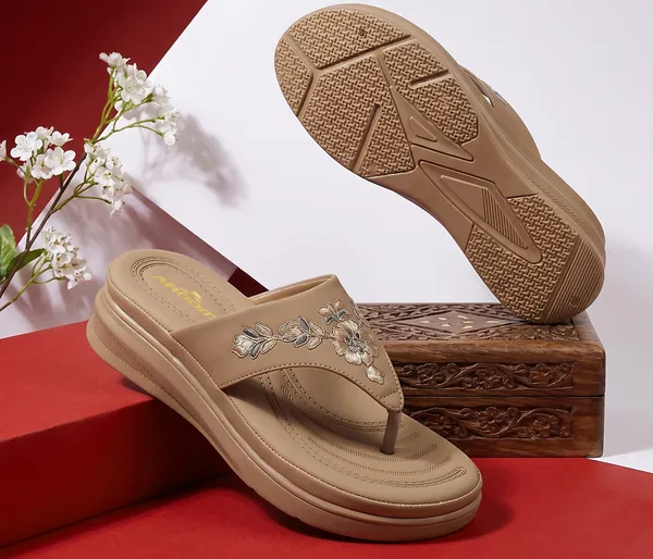 A_pair_of_stylish_women�s_slip-on_loafers_in_a_warm_tan/brown_color_with_a_subtle_ribbed_texture.