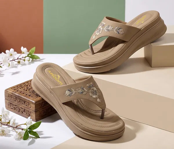 A_pair_of_stylish_women�s_slip-on_loafers_in_a_warm_tan/brown_color_with_a_subtle_ribbed_texture.