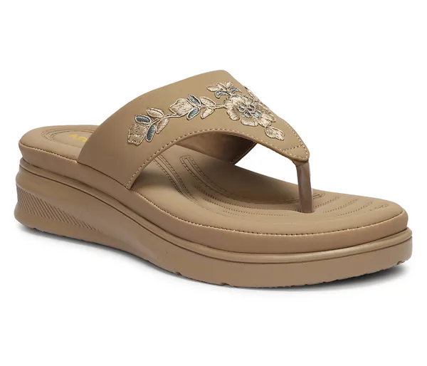 A_pair_of_stylish_women�s_slip-on_loafers_in_a_warm_tan/brown_color_with_a_subtle_ribbed_texture.