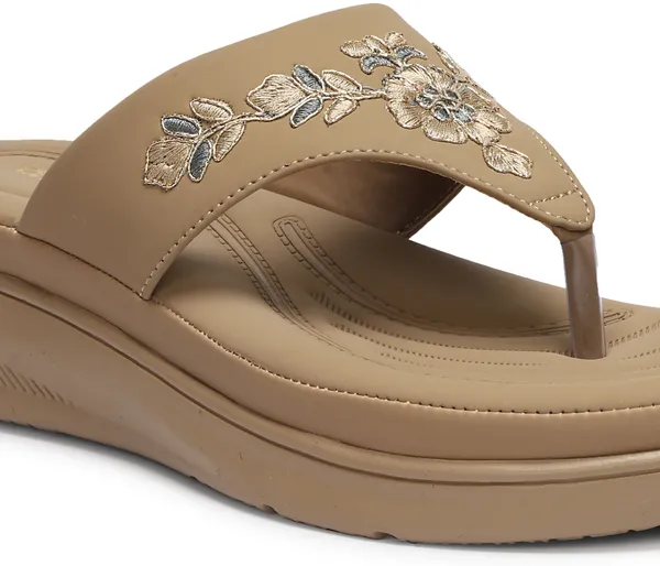 A_pair_of_stylish_women�s_slip-on_loafers_in_a_warm_tan/brown_color_with_a_subtle_ribbed_texture.
