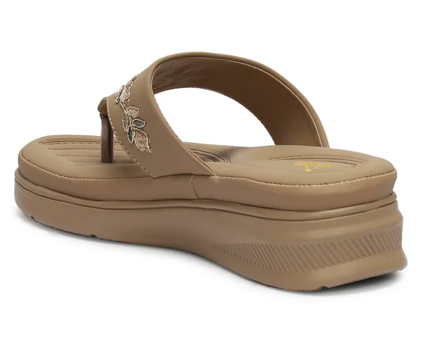 A_pair_of_stylish_women�s_slip-on_loafers_in_a_warm_tan/brown_color_with_a_subtle_ribbed_texture.
