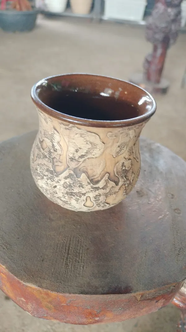 Handcrafted_Ceramic_Cup_With_Rustic_Textured_Design
