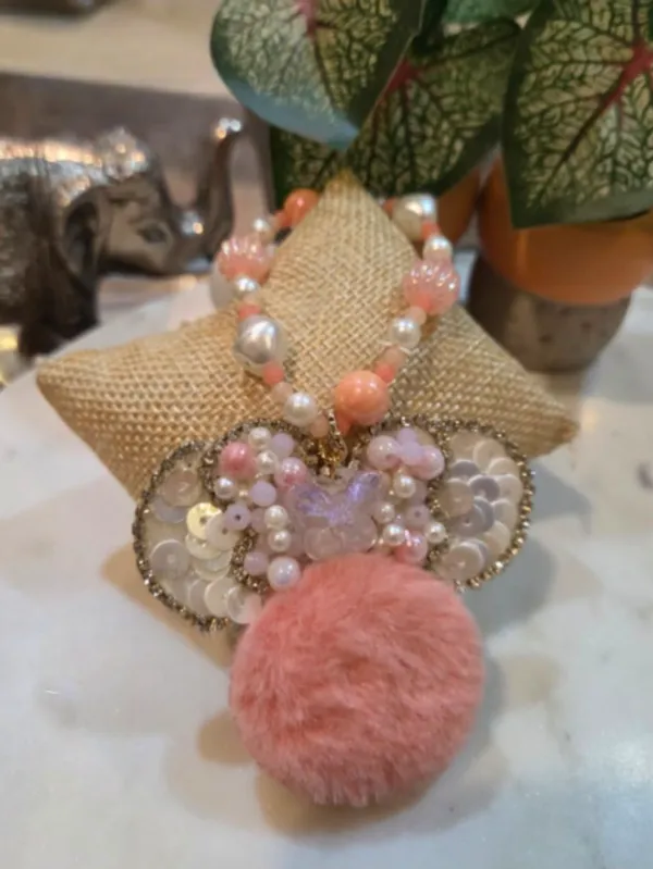 Blush_Bow_Pom_Pom_Charm_Rakhi_for_Sister_Customizable_Designer_Raksha_Bandhan_Rakhi_with_Pearl_Beads