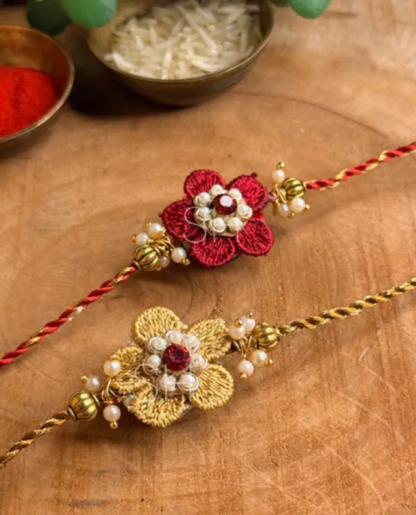 Elegant_Embroidered_Flower_Rakhi_Pair_with_Pearl_and_Bead_Embellishments_Handmade_Raksha_Bandhan_Sacred_Thread_for_Brothers_Collection