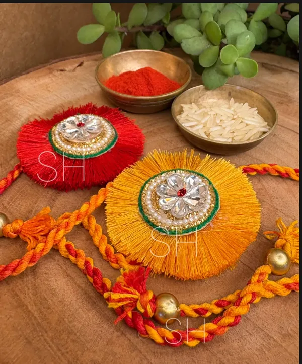 Elegant_Tassel_Designer_Rakhi_with_Crystal_Floral_Motif_Handcrafted_Raksha_Bandhan_Thread_for_Brothers_Exclusive_Festive_Gift_Collection