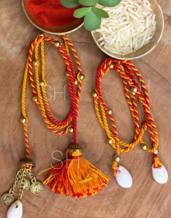 Handmade_Couple_Rakhi_Set_for_Bhaiya_Bhabhi,_Traditional_Mauli_Thread_Rakhi,_Festive_Lumba_Set_with_Kauri_Shells,_Coins_and_Tassels