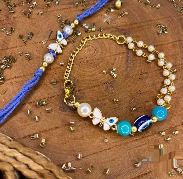 Beautiful_butterfly_and_evil_eye__charm_pair_with_white_beads_bracelet