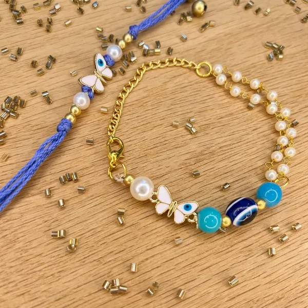 Beautiful_butterfly_and_evil_eye__charm_pair_with_white_beads_bracelet