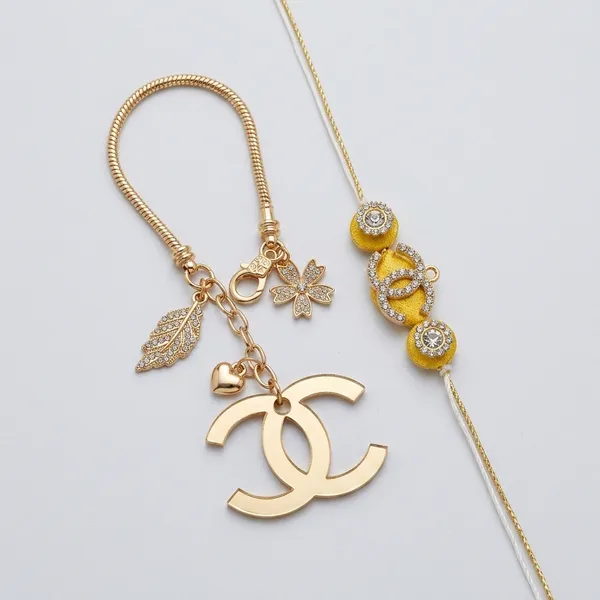 Royal_Luxe_Charm_Rakhi_with_Crystal_Gold_Chanel_Handmade_Premium_Designer_Raksha_Bandhan_Thread_for_Brother_Gift