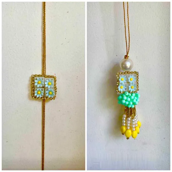 Lumba_pair_rakhi_with_cute_lil_flowers_onthe_rakhi_and_lumba