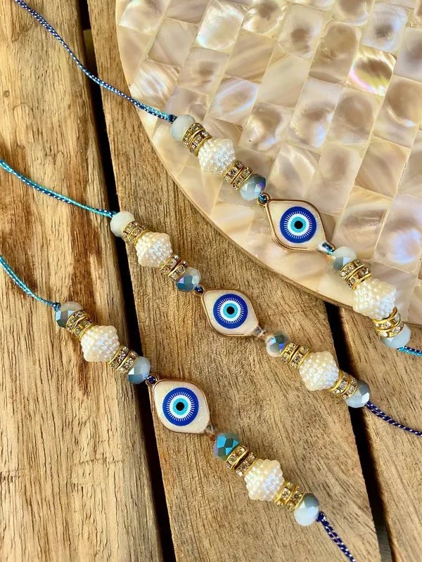 Premium_Evil_Eye_Pearl_Rakhi_with_Crystal_Beads_Handmade_Designer_Raksha_Bandhan_Thread_for_Brother_Protective_Gift_Collection