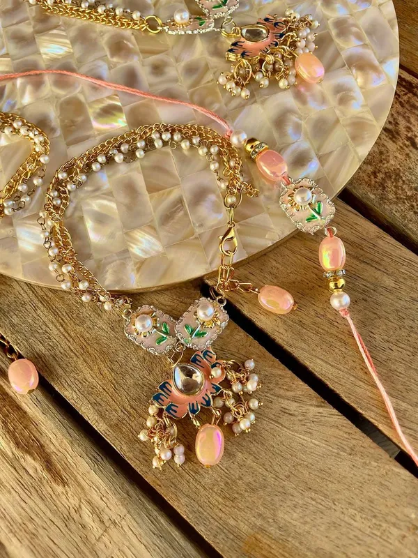 Premium_Handmade_Pearl_Lumba_Rakhi_Designer_Floral_Charm_Rakhi_with_Golden_Chain_Pink_Beads_for_Bhai_Bhabhi_Raksha_Bandhan_Gift