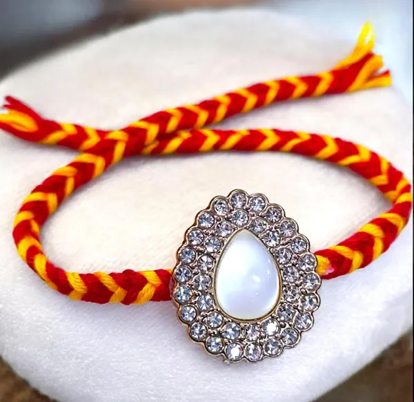 Premium_Pearl_Teardrop_Designer_Rakhi_Featuring_Sparkling_Crystal_Border_Handcrafted_Raksha_Bandhan_Sacred_Thread_for_Brother