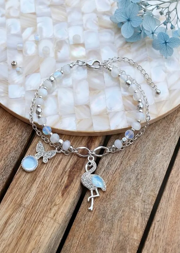 Premium_Silver_Charm_Bracelet_Rakhi_|_Flamingo_&_Butterfly_Charm_with_Moonstone_Beads