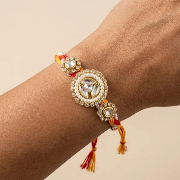 Pearl_Crest_Designer_Rakhi_with_Crystal_Center_and_Pearl_Halo_Handmade_Premium_Raksha_Bandhan_Thread_for_Brother_Gift