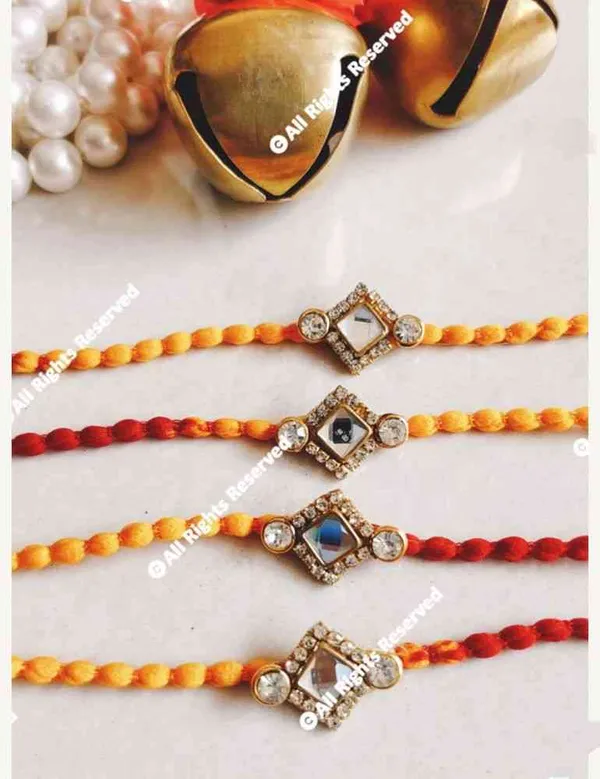 Cute_and_small_kundan_piece_in_moli_thread_rakhi