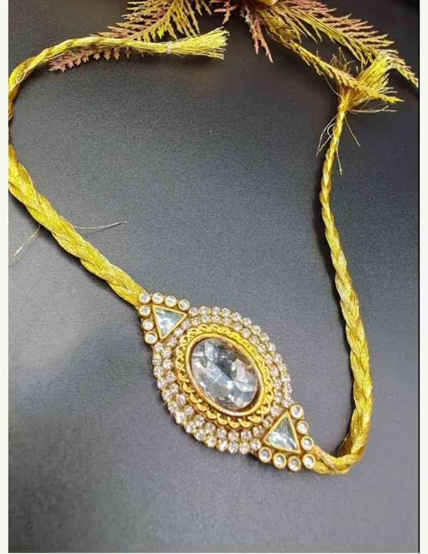 Big_size_rakhi_with_crystals_in_centre_and_embellished_with_stone
