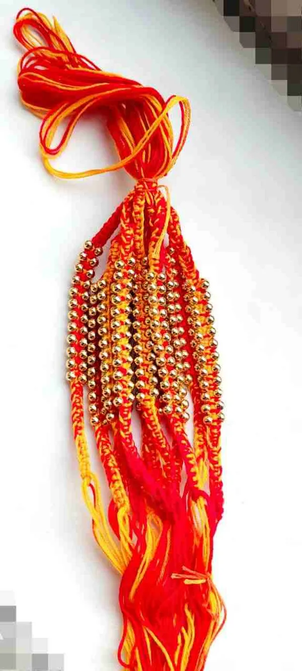 Moli_with_golden_beads_on_both_sides