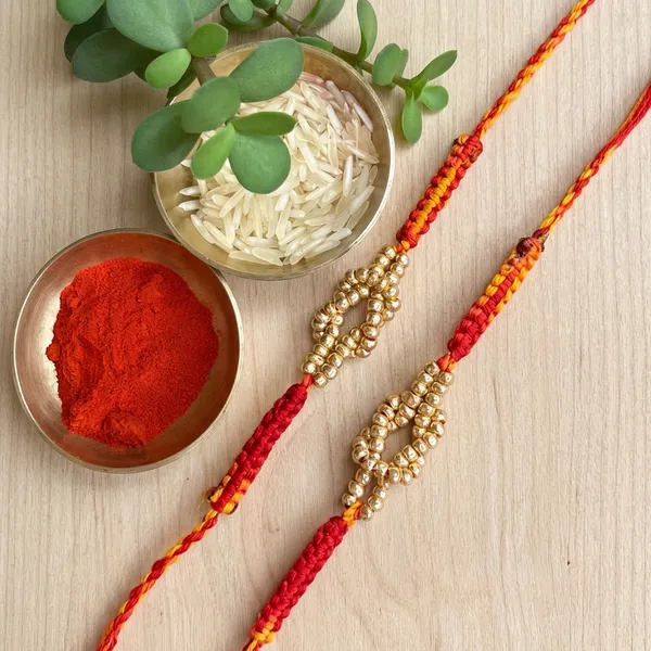 Luxury_Handmade_Pearl_Rakhi_Pair_with_Traditional_Red_Yellow_Braided_Thread_Designer_Raksha_Bandhan_Rakhi_for_Brother_Gift_Collection