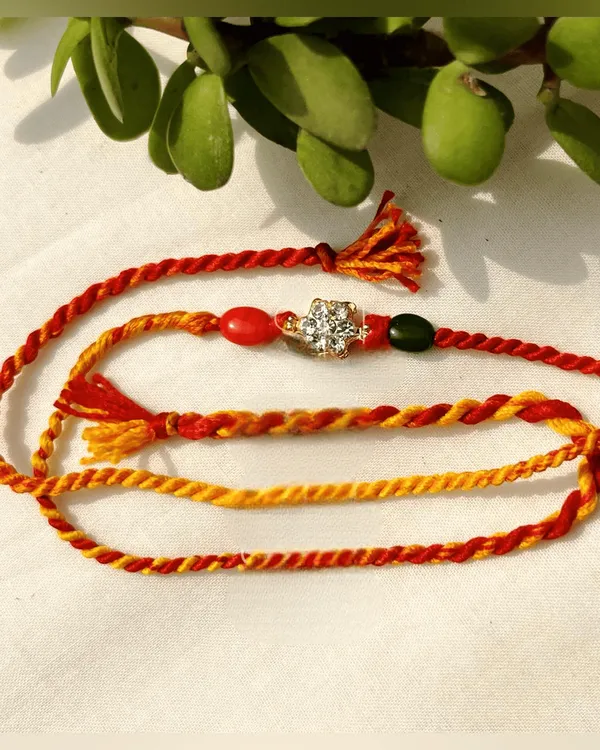 Stone_Studded_Rakhi_In_Moli_Thread