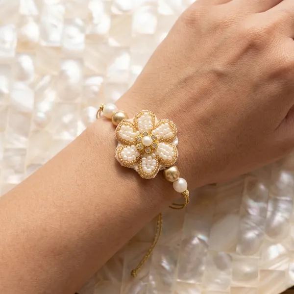 Elegant_White_Blossom_Rakhi_with_Pearl_Beads_Handmade_Traditional_Designer_Raksha_Bandhan_Gift_for_Brother