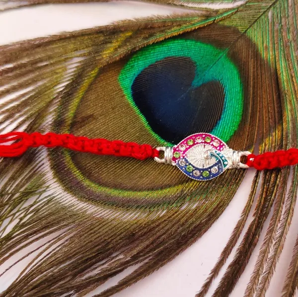 Pack_Of_1_Red_Thread_Silver_Peacock_Motif_Charm_Rakhi