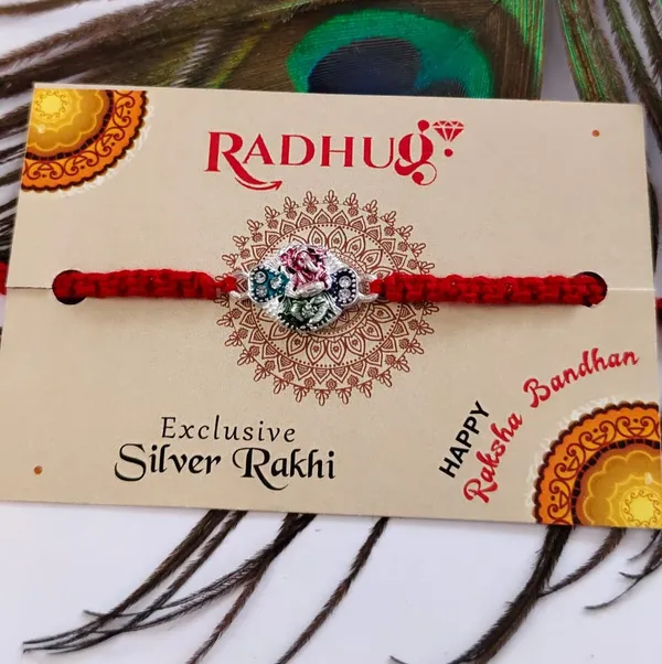 Pack_Of_1_Silver_Dancing_Ganesh_Enamel_Charm_Red_Thread_Rakhi