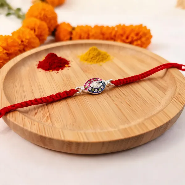 Pack_Of_1_Red_Thread_Silver_Peacock_Motif_Charm_Rakhi