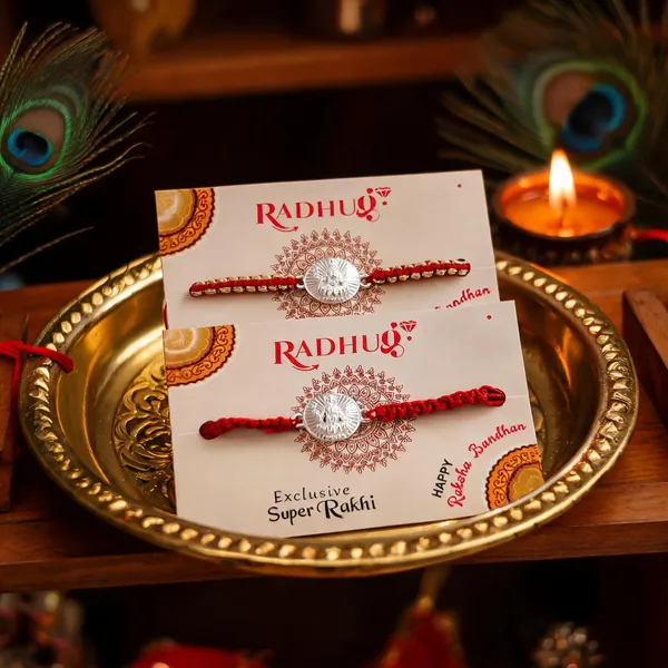 Silver_Ganesh_Lotus_Charm_Red_Thread_Rakhi_(Single_piece)