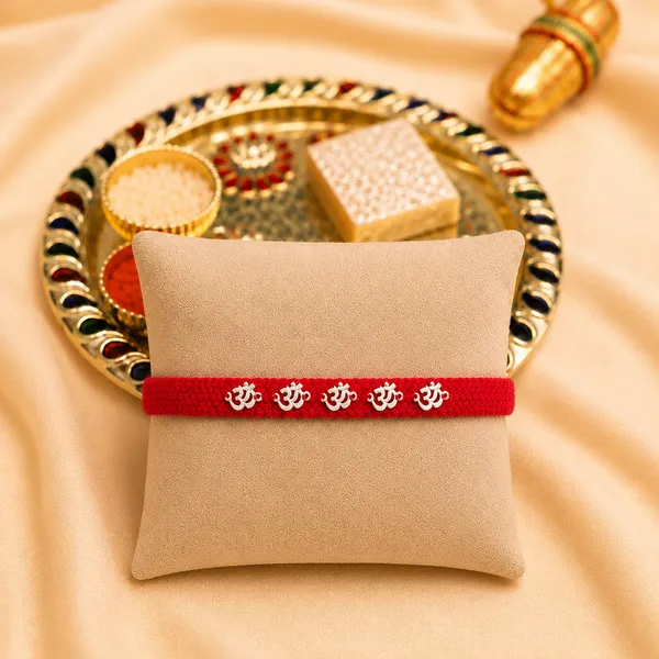 Pack_Of_1_Silver_Om_Charm_Rakhi_With_Red_Braided_Thread