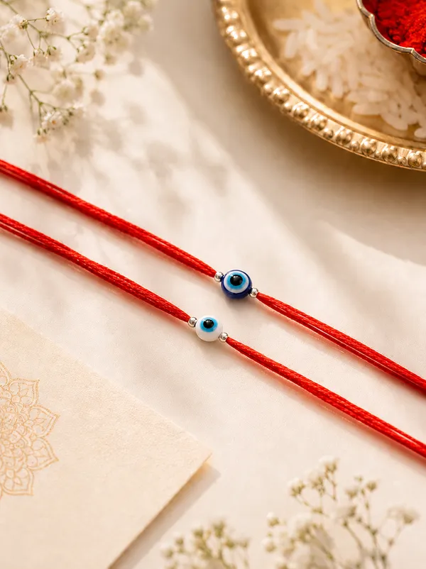 Pack_Of_4_Evil_Eye_Silver_Bead_Rakhi_With_Red_Thread