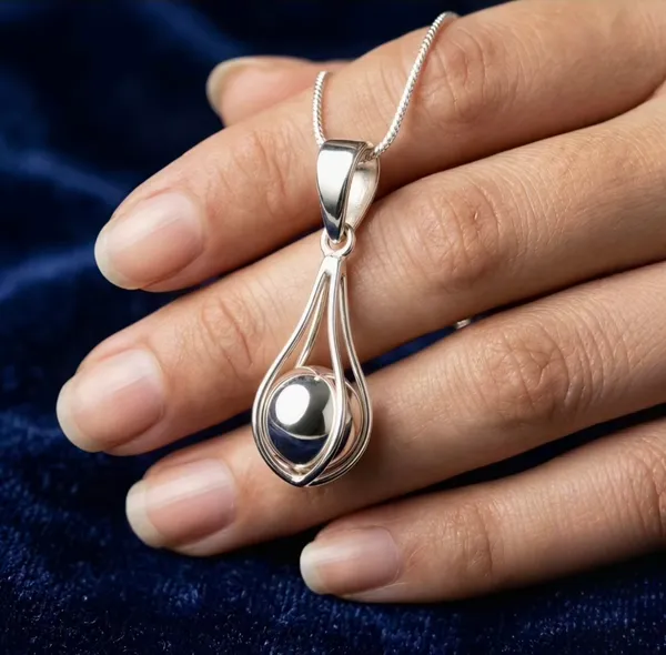 Sterling_Silver_Ball_Pendant_In_Cage_-_Chandi_Pinjre_Me_Goli_Wala_Locket_Without_Chain_For_Lal_Kitab_And_Astrology_Remedy