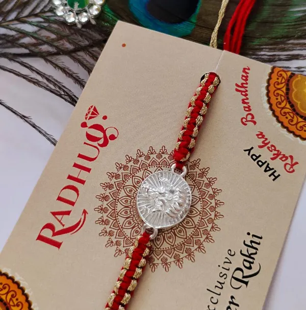 Silver_Ganesh_Lotus_Charm_Red_Thread_Rakhi_(Single_piece)