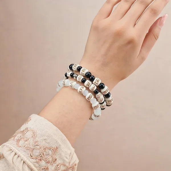 Radhe_Radhe_Engraved_Wooden_Beads_Bracelet_For_Men_And_Women,_Couple_Pack_Of_2_Black_And_White_Crystal_Combo_Hare_Krishna_Devotional_Bhakti_Stretchable_Spiritual_Wrist_Bracelet