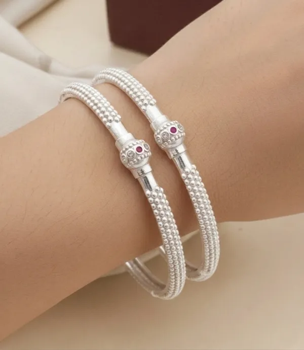 Elegant_Silver_Kada_style_bangle_with_Ruby_Accent_(Set_of_2)