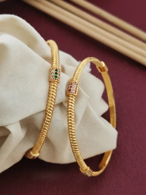 Spiral_Gold_Bangles_with_Multicolor_Stone_Accents_–_Pack_of_2