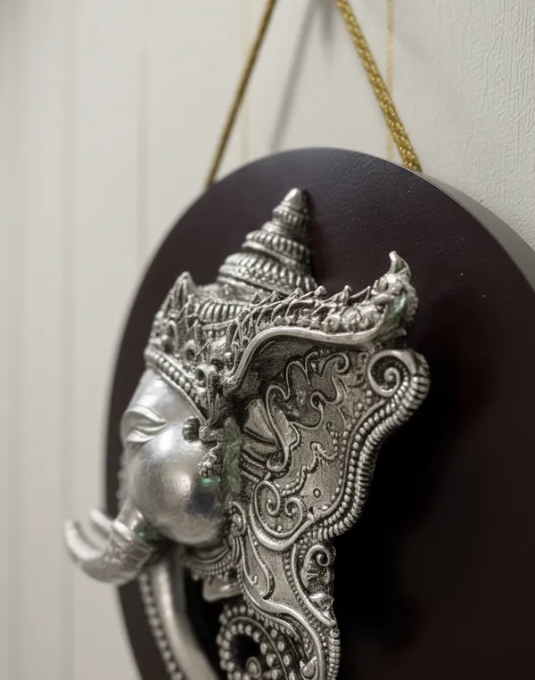 Pure_Silver_Divine_Ganesha_Face_Handcrafted_Relief_On_Circular_Wood_Stand_Wall_Hanging