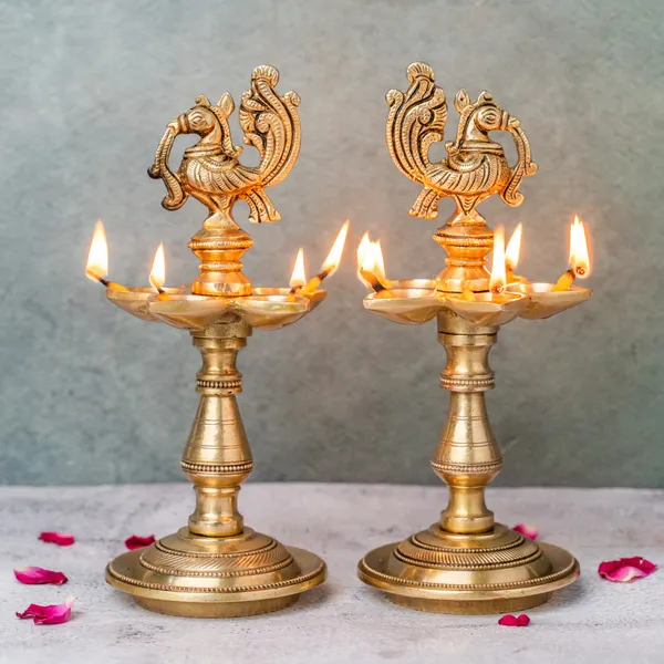 Gold_Traditional_Brass_Peacock_Oil_Lamp_Set_And_Lord_Ganesha_Idol_Pack_Of_2