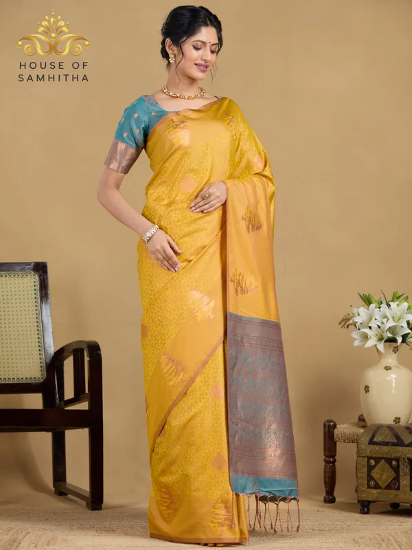 Sunshine_Yellow_Semi-Soft_Silk_Saree_With_Copper_Tree_Buttas_&_Contrast_Teal_Border