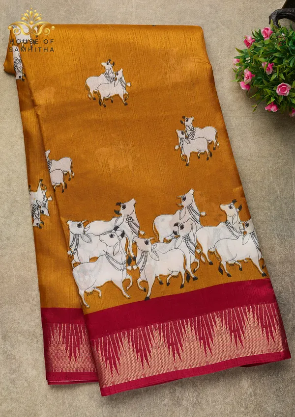 Mustard_Dola_Silk_Saree_Featuring_Traditional_Pichwai_Cow_Art_And_Contrast_Maroon_Zari_Border