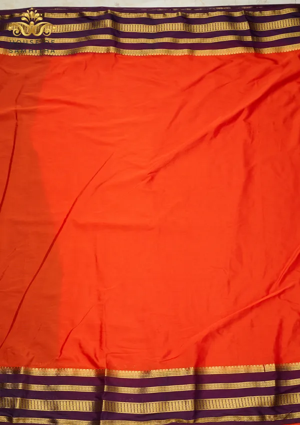 Radiant_Orange_Semi-Crape_Silk_Saree_Featuring_A_Contrast_Purple_And_Gold_Zari_Border