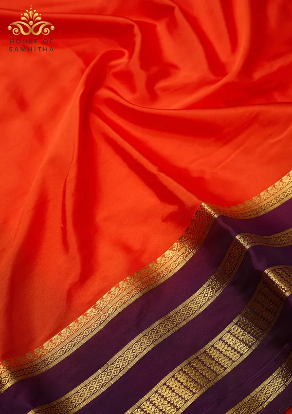 Radiant_Orange_Semi-Crape_Silk_Saree_Featuring_A_Contrast_Purple_And_Gold_Zari_Border
