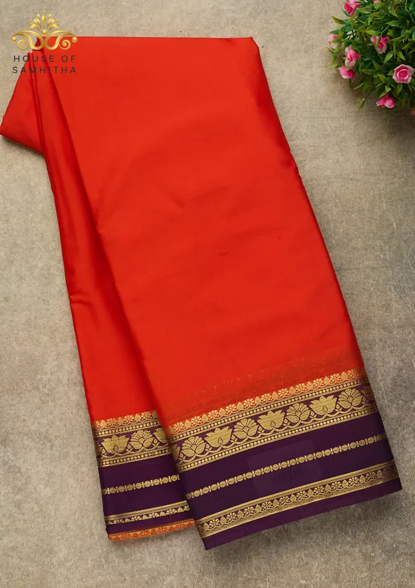 Radiant_Orange_Semi-Crape_Silk_Saree_Featuring_A_Contrast_Purple_And_Gold_Zari_Border