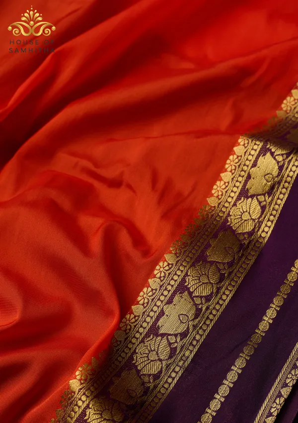 Radiant_Orange_Semi-Crape_Silk_Saree_Featuring_A_Contrast_Purple_And_Gold_Zari_Border