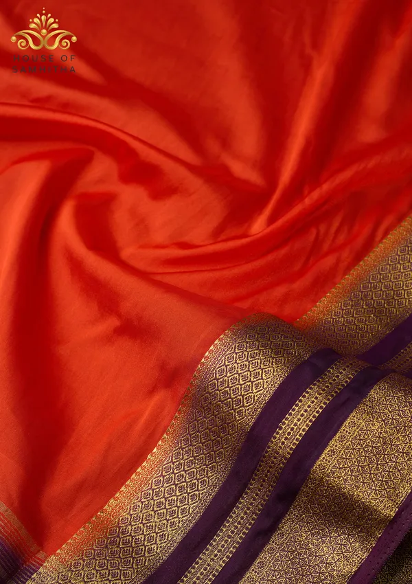 Radiant_Orange_Semi-Crape_Silk_Saree_Featuring_A_Contrast_Purple_And_Gold_Zari_Border