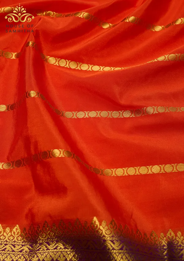 Radiant_Orange_Semi-Crepe_Silk_Saree_With_Horizontal_Zari_Stripes_And_Rich_Purple_Border